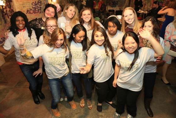 Photo of a group of young women in Chatham University 校友 t-shirts, posing for the camera
